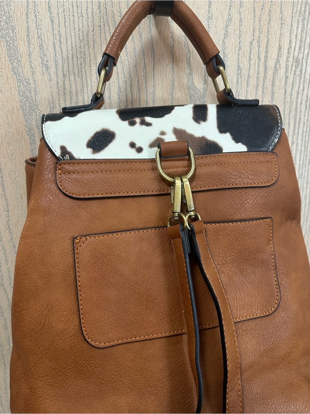 Jen & Co Brooks Convertible Cow Print Faux Leather Backpack - Picture 6 of 12